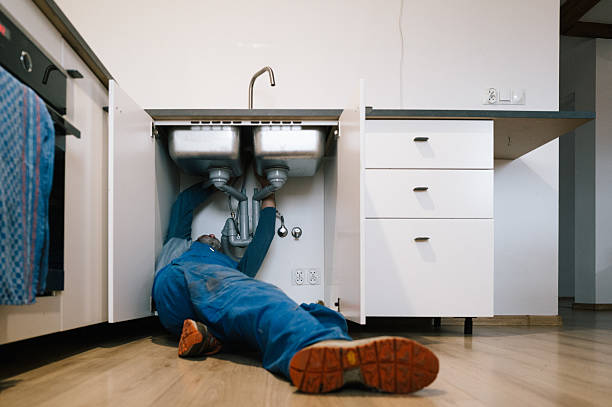 Professional Drain Cleaning technician working in Burley, WA